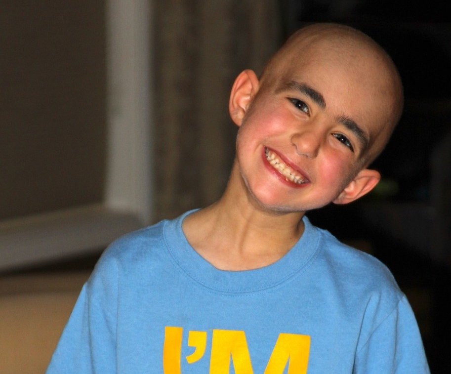 Evan Perricelli smiling at camera in a blue shirt